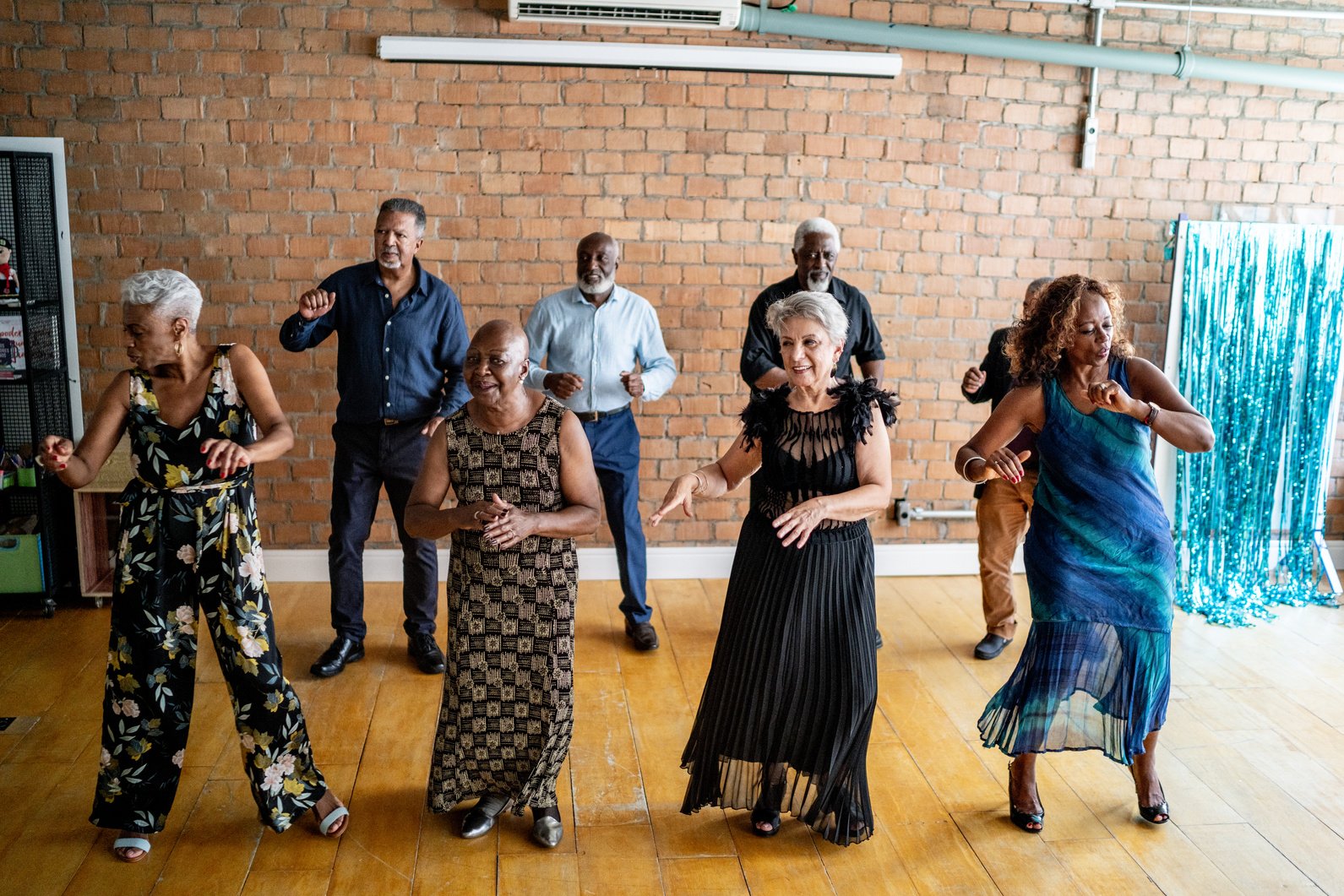 Senior friends dancing on a dance hall